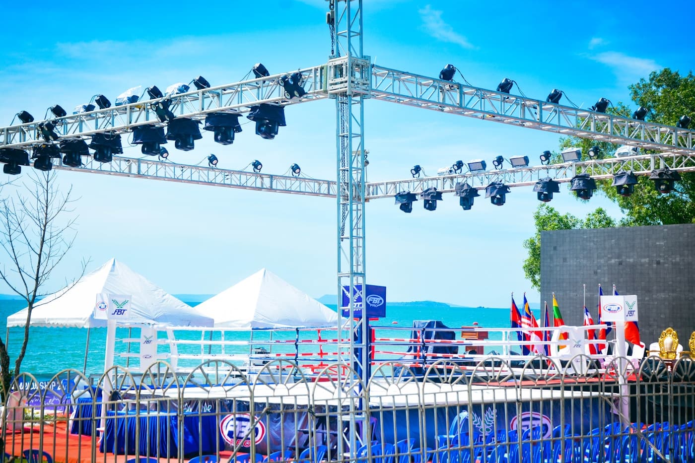 Outdoor event structure with trussing and stage support